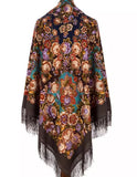 Authentic and elegant, this brown merino wool shawl can be worn by a woman seeking vintage Slavic style. Beige and navy blue floral ornaments enhance its classic appeal, while the silky fringe gives it a feminine finish.
