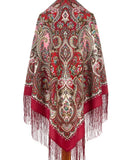Red paisley shawl with intricate patterns and fringes on a white background. The shawl is made of merino wool and silky fringe. Suitable for flamenco dancers as the shawl is large, square and in red colors.