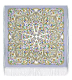 Colorful paisley patterned fabric with tassels on a white background
