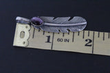 Buy a silver pendant in a shape of feather measured 2 inches.