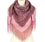 Pink Indian style cashmere scarf with paisley and mandala pattern and fringes on a mannequin against a white background