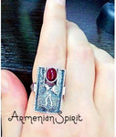 Indulge in our handcrafted, high quality 925 silver jewelry from Armenia. Adorned with a beautiful Hades and Persephone pomegranate design and an artificial red oval garnet, this ring adds a touch of elegance to any outfit. Experience the unique craftsmanship and beauty of Armenia through our collection.
