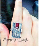 Indulge in our handcrafted, high quality 925 silver jewelry from Armenia. Adorned with a beautiful Hades and Persephone pomegranate design and an artificial red oval garnet, this ring adds a touch of elegance to any outfit. Experience the unique craftsmanship and beauty of Armenia through our collection.
