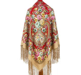 Colorful floral and paisley patterned red woolen very large shawl with fringes and yellow and pale green flowers on a white background. An e-commerce textile photograph highlighting a thick, completely opaque winter blanket shawl swatch. The red merino wool fabric showcases a dense, traditional folk pattern filled with romantic pink and yellow blossoms and intricate botanical details.