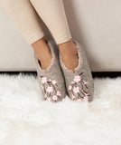 Woolen slippers on women`s legs