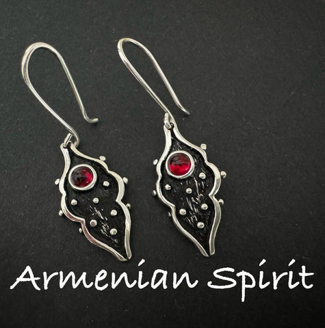 A pair of Armenian earrings with black hook design and red garnet stones on a dark background, with the text 'Armenian Spirit' displayed.
The best Armenian silver store offers handcrafted designs inspired by tradition. Each item is made with care and sent directly from Armenia. The shop is reliable, ensuring safe international shipping. Ideal for those searching for where to buy silver jewelry after closing Armenian stores on Etsy. Armenian Spirit is now the top online silver seller for ethnic pieces.


