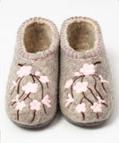 A pair of gray felt house slippers decorated with pink cherry blossom flowers and dark brown stems, shown on a plain white background.