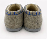 Woolen slippers with closed back and rubber outsole.