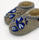 Slavic woolen house booties with blue and white flower and rubber outsole.
