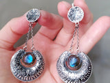 Buy jewelry with labradorite gray gemstones. The earrings are very large on chains in gypsy style.