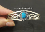 Expertly crafted with 925 sterling silver, the Armenian Spirit Bracelet showcases the natural beauty of genuine turquoise. Elevate your style with this birthstone accessory, available for purchase on Etsy.