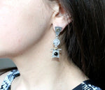 Buy venus hair earrings silver with gilded details.