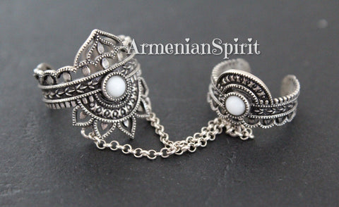 Discover the beauty of traditional Armenian design with our Double Ring with white stones Sterling Silver 925. Handcrafted with the highest quality of silver, this elegant jewelry piece showcases the best of Armenian spirit. Elevate your style with this unique and timeless piece, available on Etsy and ebay..