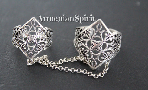 Crafted with high-quality sterling silver, the Double Ring Armenian Spirit showcases the folk traditions of Armenia. These intricate double rings highlight the rich cultural heritage and craftsmanship of the region. Elevate any outfit with this elegant and unique piece. Shop now on etsy and ebay.