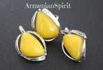 Very delicate feminine jewelry with Baltic amber gemstone made of sterling silver 925 and ornament. The earrings and ring have intersting triangle shae with polished smooth yellow amber gem.