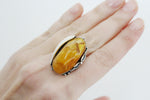 Ring silver 925 stamp with natural honey amber gemstones. This artisan jewelry is one of a kind and single copy. The ring doesn`t have repetitions.