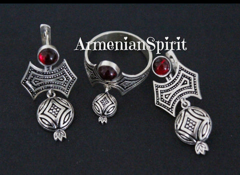 This pomegranate jewelry is made in Armenian folk style with small dangling pomegranates and red garnet gemstones. The material is sterling silver 925. The jewelry is very lightweight and comfortable.