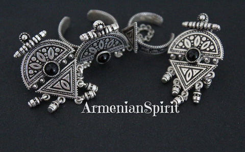 Experience the elegance of Armenian Spirit with our high quality Sterling Silver 925 small dangle earrings. Each earring features a stunning black onyx stone and ring, inspired by the intricate patterns of Western Armenian jewelry. Elevate your style with Taraz Armenian jewellery.  Our hyppoalergic sterling silver 925 pieces are high quality and won't cause any irritations. Buy online from our platform for the best purchases on Etsy and eBay. 