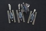 Set of silver earrings ring and pendant rectangle with blue transparent stone buy online.