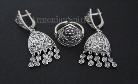 Elevate your style with our high-quality sterling silver 925 jewelry handcrafted by skilled artisans in Armenia. The traditional taraz earrings and ring feature intricate ornaments with small dangling details and an eternity sign for a touch of elegance. Inspired by the Armenian Van and Vaspurakan style, the ring is uniquely designed in a triangle shape.

