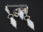 Add a touch of Armenian Spirit to your jewelry collection with these unique earrings and ring set. Crafted from high quality sterling silver and gold plating, each piece features a stunning white moonstone with a blue tint. Elevate your style with this contemporary and gemstone adorned design. Shop with confidence on popular platforms like Etsy and eBay and take advantage of our discounts. Elevate your style with every purchase!