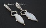 Introducing our high-quality sterling silver 925 earrings, featuring long gemstones and a gold-plated silver 925 frame. The blue-tinted white moonstone from Armenian Spirit adds a touch of uniqueness to the contemporary design. Elevate your jewelry game with these stunning earrings.Don't miss out on the best deals on Etsy and eBay - we sell on all the top platforms!  