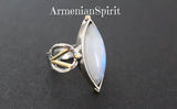 Elevate your jewelry collection with our high quality sterling silver 925 ring from Armenian Spirit. The white moonstone with a blue tint is set in gold plated silver, creating an unusual and contemporary design. Experience the benefits of lunar stone in this unique gemstone ring. Enjoy discounts and free shipping with tracking when you purchase our jewelry online. Don't wait, buy the best on Etsy and eBay from our quirky and playful store!