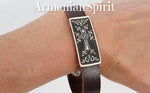 Buy Armenian bracelet for men with genuine leather and silver cross on plate with eternity arevakhach symbol and taraz pattern. The bracelet is suitable also for Armenian woman.