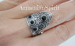 Armenian tradtional symbols in silver jewelry are arevakhach eternity sign and flowers which has ethnic tribal style. This ring is made of sterling silver 925 and four small black onyx gemstones. The ring is adjustable but for sizes US 8, US 8.5, US 9 and US 9.5. for thick fingers. The jewelry is made by Armenian artisans and have unique design.