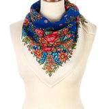 Colorful vintage peony floral blue, ivory and blue merino wool Slavic scarf on a mannequin with a white background