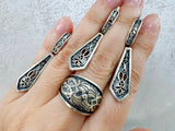 Looking for high quality and hypoallergenic jewelry that makes a statement? Look no further than Armenian Spirit on Etsy! Our long slim earrings, adjustable ring and long pendant feature a traditional Armenian taraz pattern, perfect for everyday wear. Crafted from sterling silver 925, they are suitable for sensitive skin. Plus, enjoy free worldwide shipping and discounts when you buy online. 
