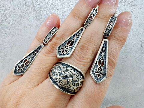Looking for high quality and hypoallergenic jewelry that makes a statement? Look no further than Armenian Spirit on Etsy! Our long slim earrings, adjustable ring and long pendant feature a traditional Armenian taraz pattern, perfect for everyday wear. Crafted from sterling silver 925, they are suitable for sensitive skin. Plus, enjoy free worldwide shipping and discounts when you buy online. 
