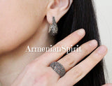 a jewelry set on a woman marcasite teardrop earrings and ring