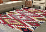 Multicolored Armenian patterned farm style house rug in bright yellow and red colors on a wooden floor with a living room setting.