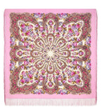 Pink scarf with floral and paisley pattern made of merino wool and silky fringe.