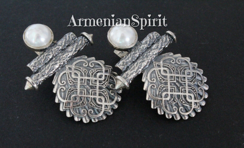 Elevate your look with our stunning handmade earrings crafted with high quality sterling silver 925. Featuring elegant pearls and intricate geometric details, these chunky statement pieces are inspired by traditional Armenian jewelry. Perfect for adding a touch of Boho chic to dresses or a touch of sophistication to formal jackets.
