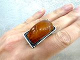 Elevate your jewelry collection with our high-quality honey amber large rectangle ring, handcrafted by skilled Armenian artisans. Made with sterling silver 925, this piece exudes beauty and sophistication. Enjoy a unique and luxurious addition to your wardrobe.
