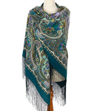 Paisley patterned merino wool wrapping scarf with fringes on a mannequin against a white background