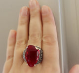 This handcrafted, vintage-style ring features intricate marcasite embellishments and a vibrant, transparent red stone. Made of high-quality sterling silver 925, it showcases exceptional craftsmanship and timeless elegance. Elevate any outfit with this stunning Armenian jewelry piece.

