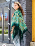 The green and yellow Slavic shawl features strong, rich colors. A woman wearing it can style it easily for everyday wear or special moments.