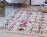 Decorative Armenian beige and red rug with geometric pattern in a room setting. Traditional kilim decor to buy for cafe and restaurant in eastern style.