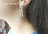 Long dangle modern earrings with small round amber and sun gold plated details