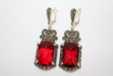 Vintage-style dome drop earrings with oxidized silver filigree, marcasite accents, and a teardrop red stone, from the Armenian Spirit collection.