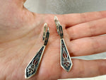 What truly sets these sterling silver earrings apart is the incorporation of traditional Armenian ornaments. The designs are often influenced by the styles of Kars and Vanatur, regions rich in cultural heritage. You might find repeating geometric patterns, stylized floral motifs, or intricate filigree work, all meticulously executed. These aren't simply decorative elements; they are symbols that carry meaning and connect the wearer to a rich cultural past. 