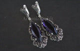 Purple stone earrings long with marcasite and made from sterling silver 925 on a black background with brand title Armenian Spirit.