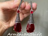 Upgrade your jewelry collection with our luxurious extra long earrings. Made with high quality sterling silver 925, these classic earrings feature a transparent red stone and marcasite, perfect for shining at parties or on the Monaco France riviera. Shop online at Armenian Spirit jewelry store for top-quality pieces.
