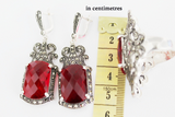 Long Tudor-style dome earrings with a vibrant crimson centerpiece and paved marcasites, reflecting the traditional heritage of the Armenian Spirit brand.