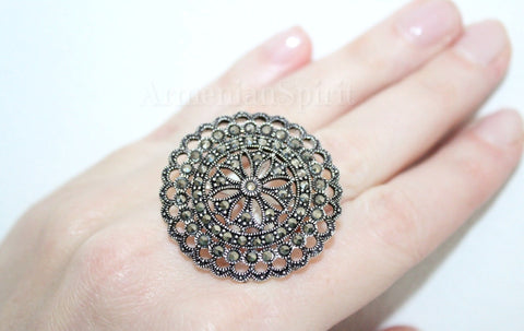 A sterling silver 925 extra big round ring with unusual Marcasite stones, displayed on a person's hand. Find where to buy silver jewelry after Etsy shop closures.

