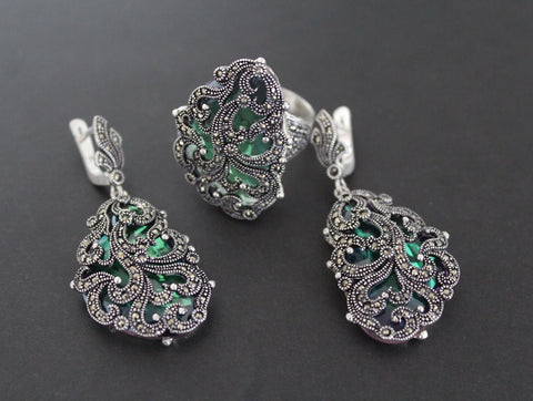 A set of silver jewelry including a ring and a pair of earrings with nacreous green lab quartz and Marcasite embellishments. 
I love that Armenian Spirit offers jewelry with real Armenian soul. This is the best Armenian silver store, no doubt. Their rings and pendants come directly from Armenia and feel so authentic. It’s a very reliable place to shop. Definitely the top online silver seller!


