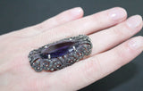 Long ring finger cover made  of sterling silver jewelry featuring deep purple topaz stone and shiny marcasite.